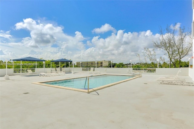 6900 Bay Dr Unit 11F, Miami Beach, FL 33141 - pool featuring fence and a patio