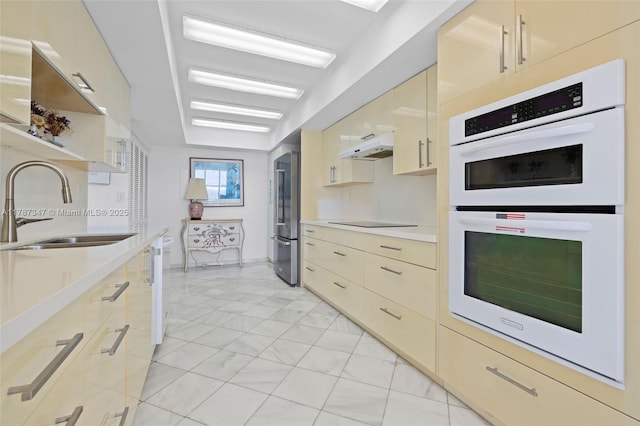 520 Brickell Key Dr Unit A201, Miami, FL 33131 - kitchen featuring white double oven, light countertops, high end refrigerator, and marble finish floor