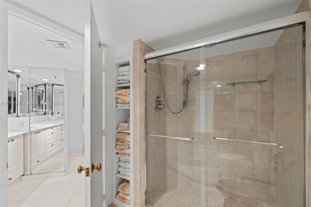 520 Brickell Key Dr Unit A201, Miami, FL 33131 - full bathroom with a shower stall, visible vents, tile patterned flooring, and vanity