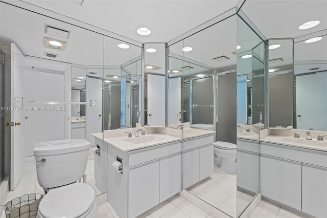 520 Brickell Key Dr Unit A201, Miami, FL 33131 - full bathroom featuring toilet, two vanities, and a sink