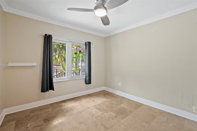 spare room with ornamental molding, stone finish flooring, ceiling fan, and baseboards