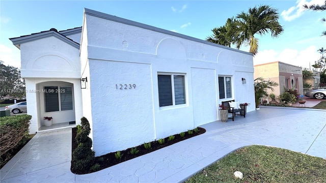 12239 NW 7th St, Miami, FL 33182 - view of side of property with stucco siding