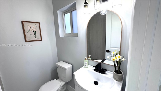 bathroom with toilet and vanity