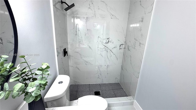 full bathroom featuring a shower stall and toilet