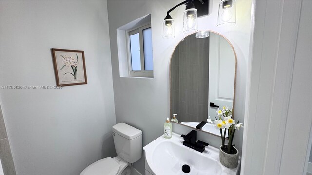 12239 NW 7th St, Miami, FL 33182 - bathroom with toilet and a sink