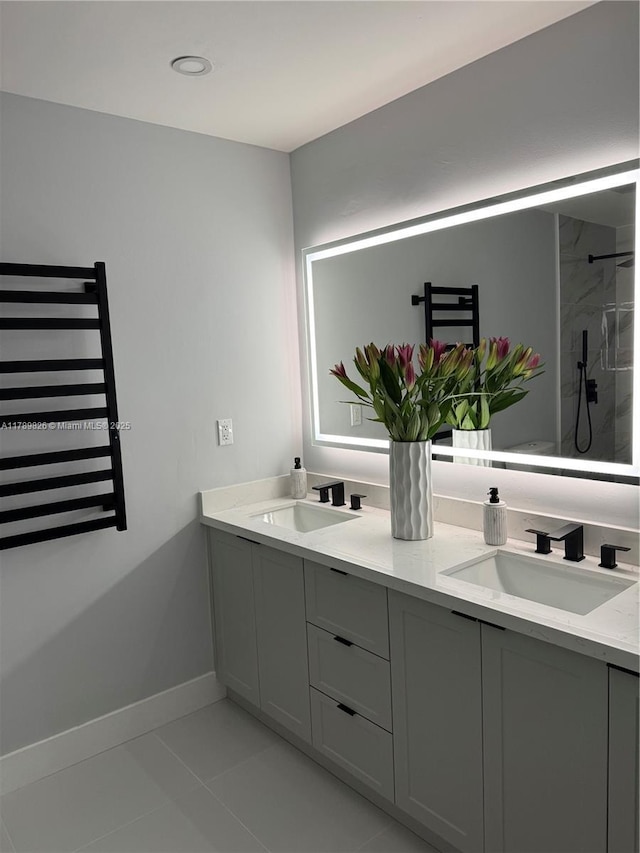 full bath featuring radiator heating unit, tile patterned floors, walk in shower, and a sink