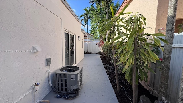 12239 NW 7th St, Miami, FL 33182 - view of home's exterior featuring stucco siding and central AC unit