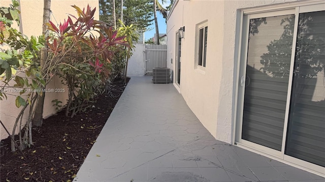 12239 NW 7th St, Miami, FL 33182 - view of home's exterior featuring stucco siding and cooling unit