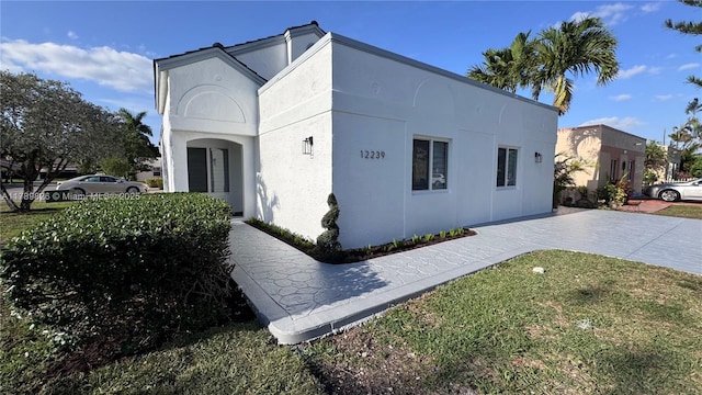 12239 NW 7th St, Miami, FL 33182 - view of side of property featuring stucco siding