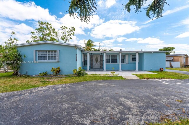 11024 SW 51st Ter, Miami, FL 33165 - single story home with a front lawn and stucco siding