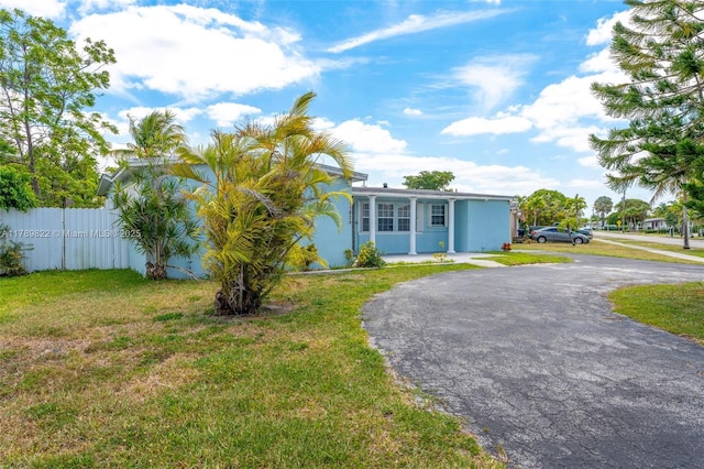 11024 SW 51st Ter, Miami, FL 33165 - manufactured / mobile home featuring a front yard, fence, and aphalt driveway