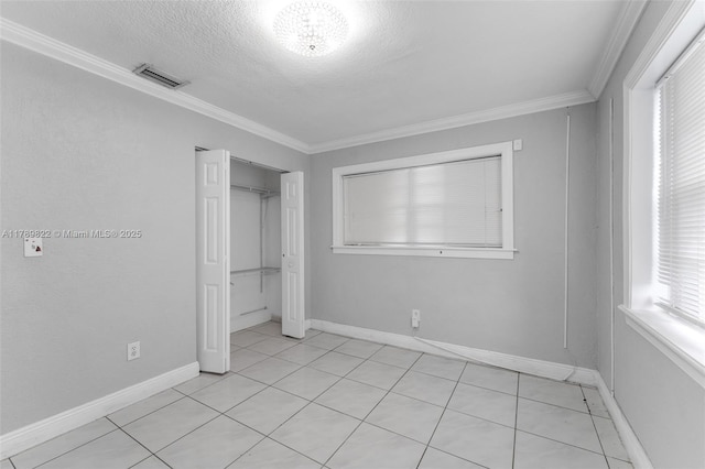11024 SW 51st Ter, Miami, FL 33165 - unfurnished bedroom featuring baseboards, ornamental molding, a textured ceiling, and visible vents