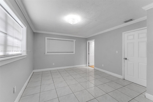 11024 SW 51st Ter, Miami, FL 33165 - empty room with visible vents, a textured ceiling, light tile patterned floors, and crown molding