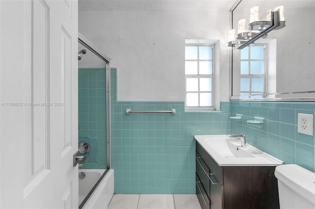 11024 SW 51st Ter, Miami, FL 33165 - full bath featuring bathing tub / shower combination, toilet, tile walls, wainscoting, and vanity
