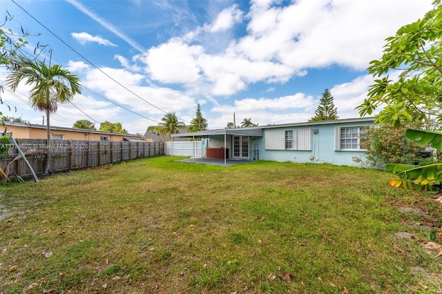 11024 SW 51st Ter, Miami, FL 33165 - rear view of house with fence, french doors, a yard, and a patio