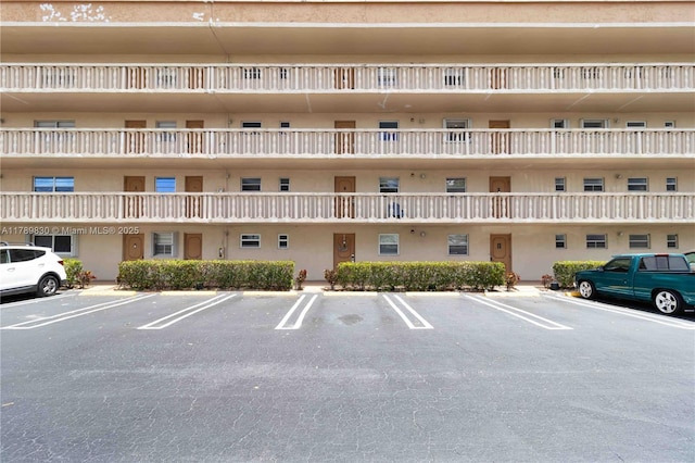 view of property with parking