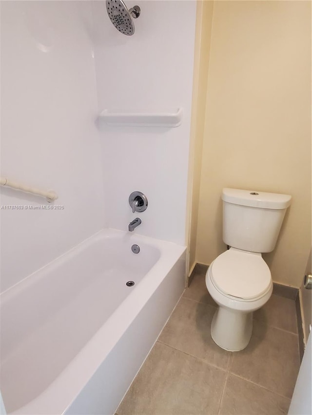 bathroom featuring shower / bathtub combination, baseboards, tile patterned flooring, and toilet