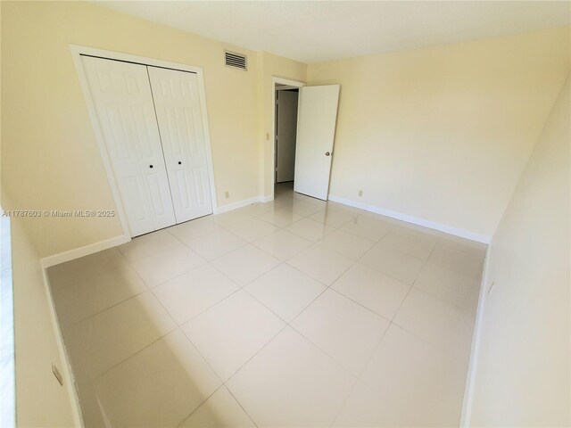 16210 Laurel Dr Unit 203, Weston, FL 33326 - unfurnished bedroom with a closet and light tile patterned floors