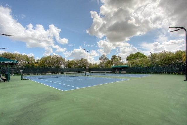 view of sport court with fence
