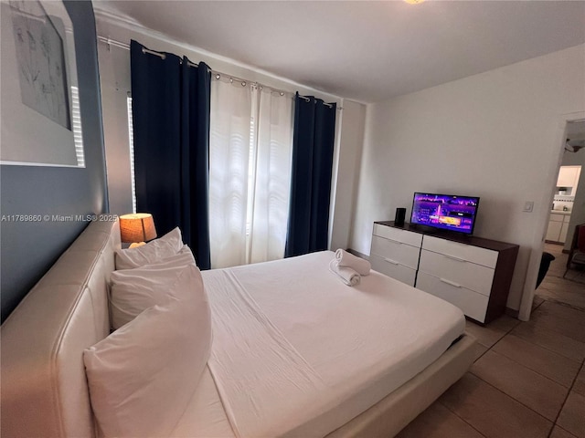 bedroom with tile patterned floors