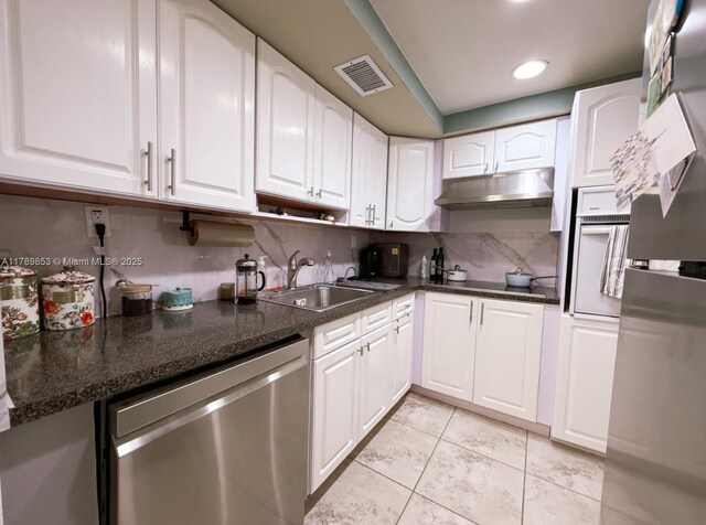 1200 W Ave Unit 1021, Miami Beach, FL 33139 - kitchen with white cabinets, under cabinet range hood, visible vents, stainless steel dishwasher, and a sink