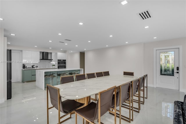 dining space featuring visible vents and recessed lighting