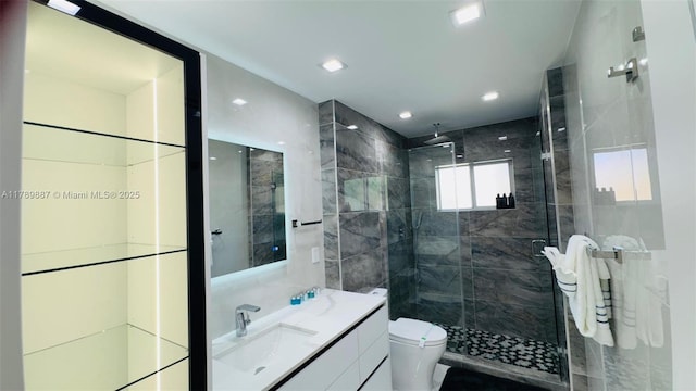 full bathroom with vanity, toilet, and a shower stall
