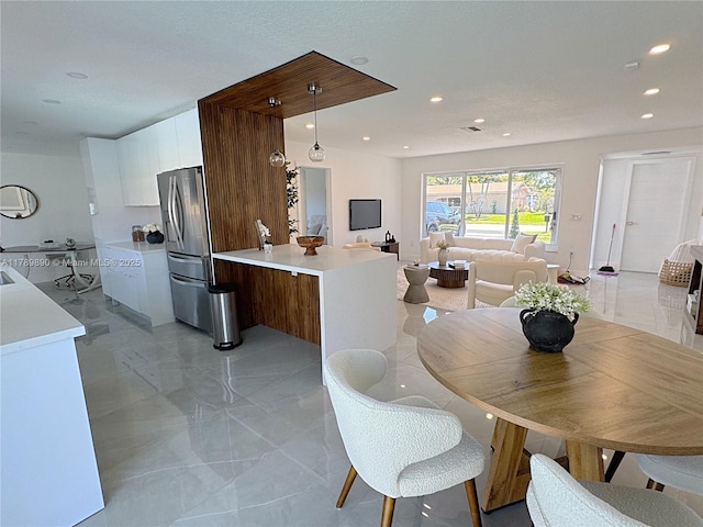8911 NW 7th Ct, Pembroke Pines, FL 33024 - dining space featuring marble finish floor, visible vents, and recessed lighting
