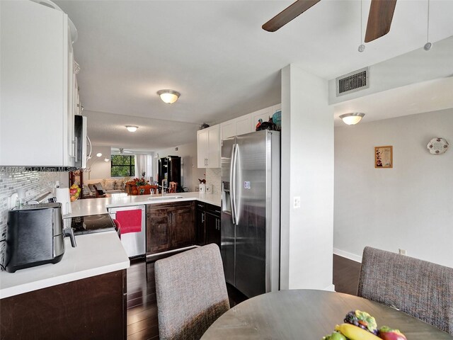 2704 NW 104th Ave Unit 308, Sunrise, FL 33322 - kitchen featuring stainless steel fridge with ice dispenser, backsplash, light countertops, visible vents, and a ceiling fan