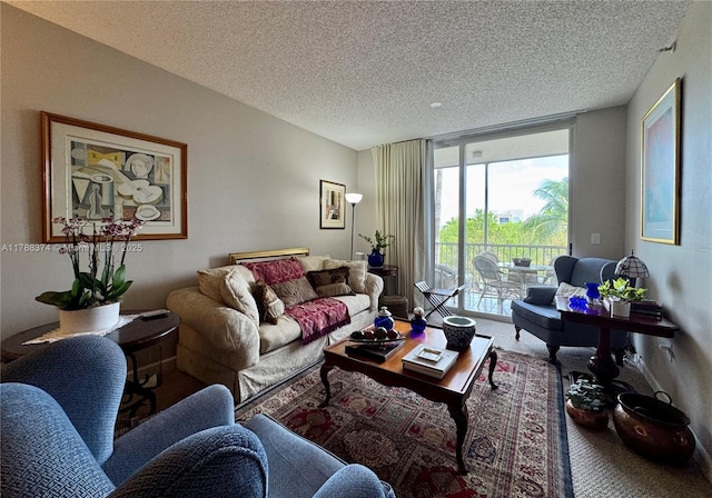 living area with expansive windows, carpet flooring, and a textured ceiling