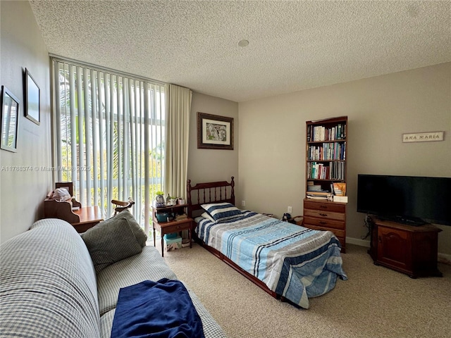 carpeted bedroom with a textured ceiling