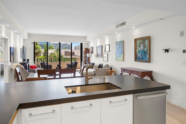 201 Crandon Blvd Unit 333, Key Biscayne, FL 33149 - kitchen featuring open floor plan, stainless steel dishwasher, and dark countertops