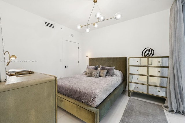 bedroom with visible vents and light tile patterned floors