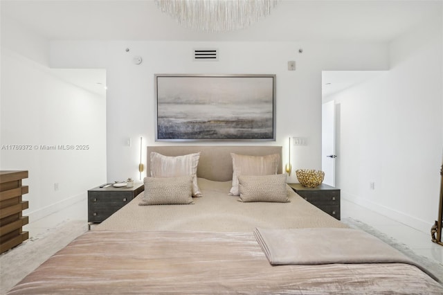 bedroom with visible vents and baseboards