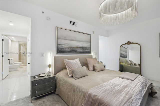 bedroom featuring visible vents and ensuite bathroom