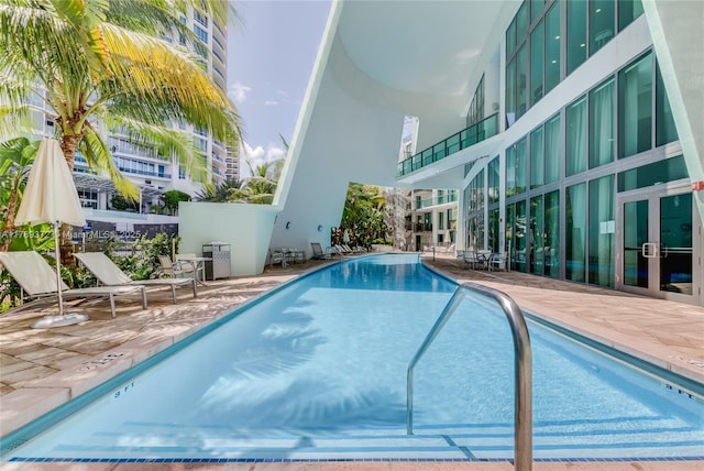 community pool featuring a patio area