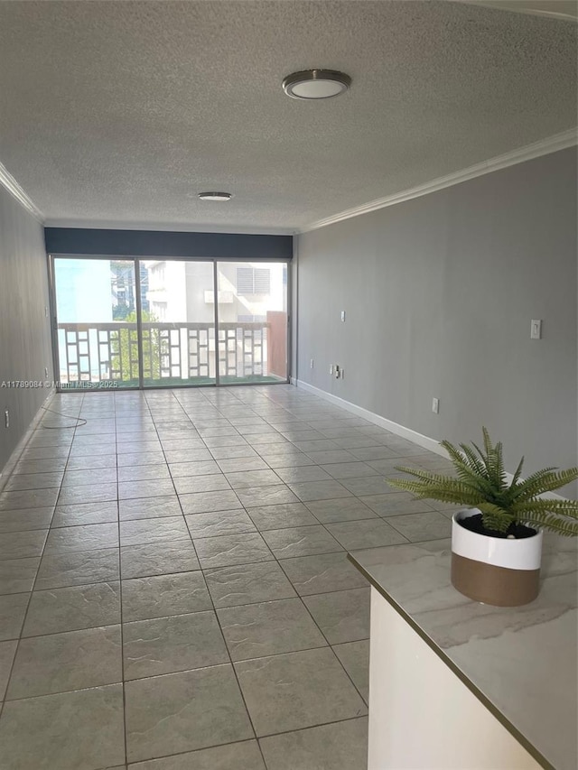 600 NE 25th St Unit 60, Miami, FL 33137 - empty room with baseboards, crown molding, a textured ceiling, and a healthy amount of sunlight