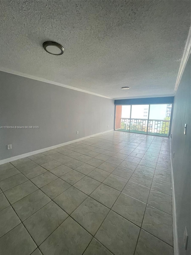 600 NE 25th St Unit 60, Miami, FL 33137 - spare room featuring a textured ceiling, baseboards, and ornamental molding