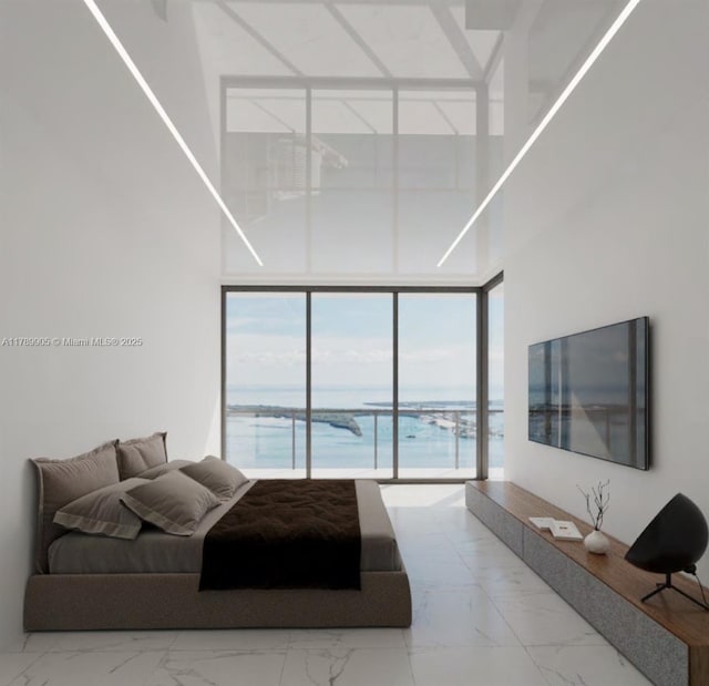 bedroom with a wall of windows, access to exterior, marble finish floor, and a towering ceiling
