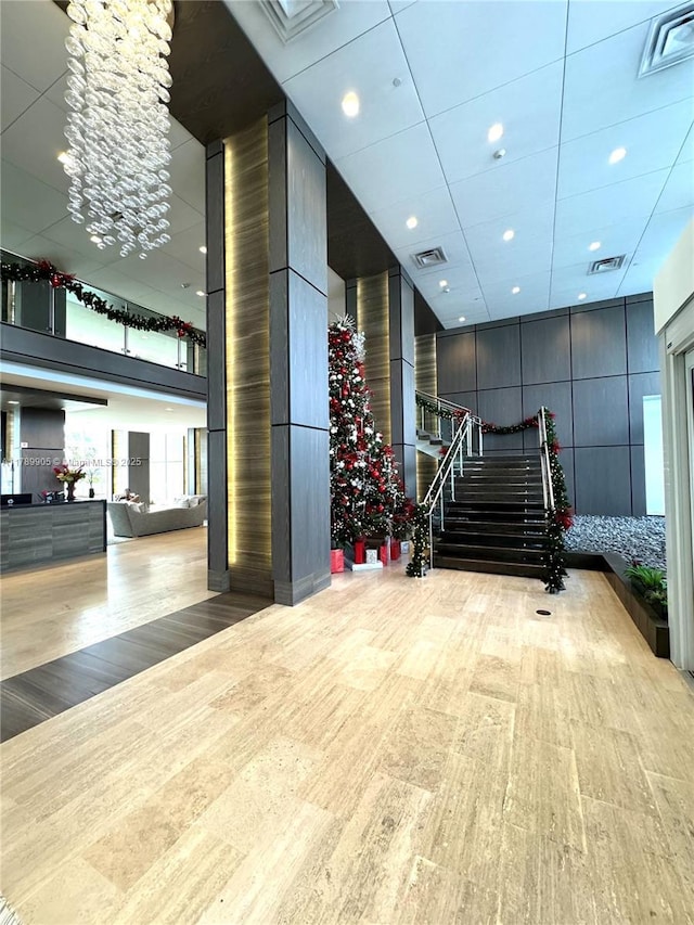 community lobby featuring stairs and visible vents