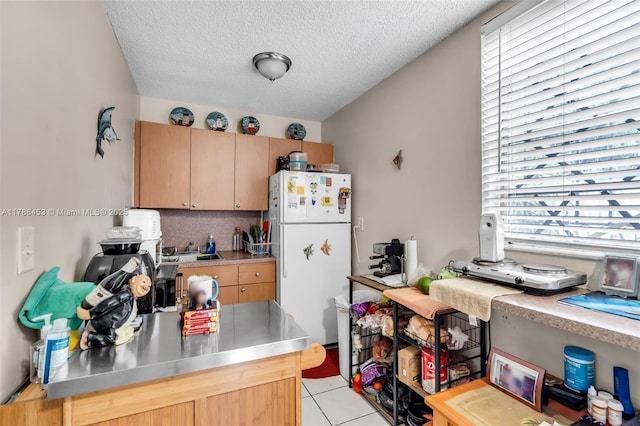 35 SW 60th Ave, Miami, FL 33144 - kitchen with stainless steel counters, light brown cabinets, plenty of natural light, and freestanding refrigerator