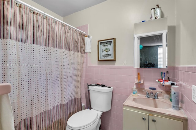 35 SW 60th Ave, Miami, FL 33144 - full bathroom featuring tile walls, toilet, vanity, and a wainscoted wall