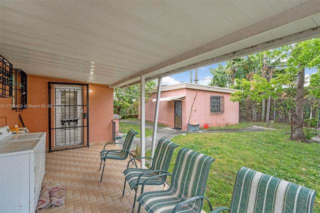 35 SW 60th Ave, Miami, FL 33144 - view of patio / terrace featuring washing machine and clothes dryer