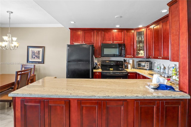 kitchen featuring a notable chandelier, dark brown cabinets, a sink, black appliances, and ornamental molding
