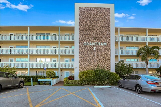 view of property featuring uncovered parking