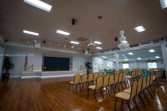 miscellaneous room featuring wood finished floors, visible vents, and baseboards