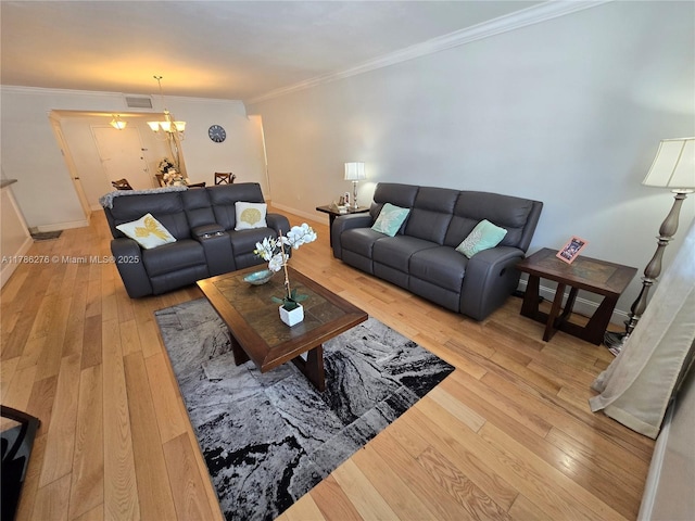 5825 Collins Ave Unit 2D, Miami Beach, FL 33140 - living area featuring crown molding, visible vents, baseboards, and wood-type flooring