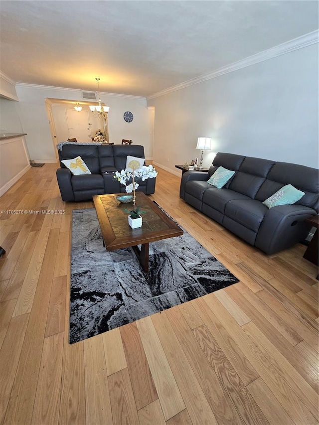 5825 Collins Ave Unit 2D, Miami Beach, FL 33140 - living room with hardwood / wood-style floors, visible vents, baseboards, and ornamental molding