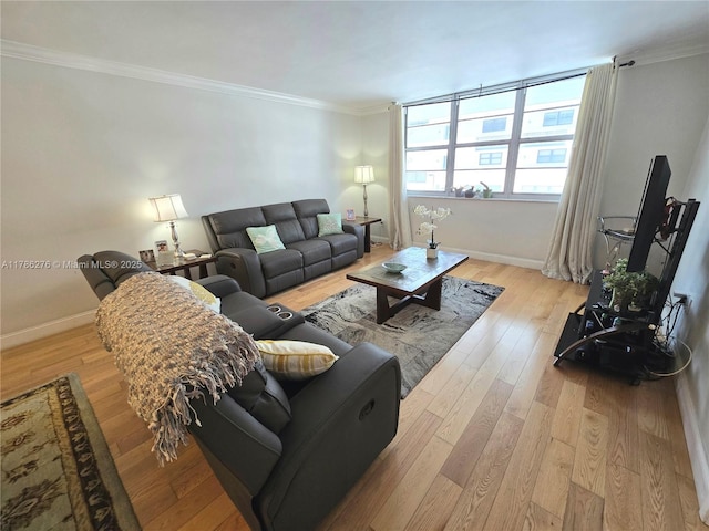 5825 Collins Ave Unit 2D, Miami Beach, FL 33140 - living room with light wood-type flooring, crown molding, and baseboards