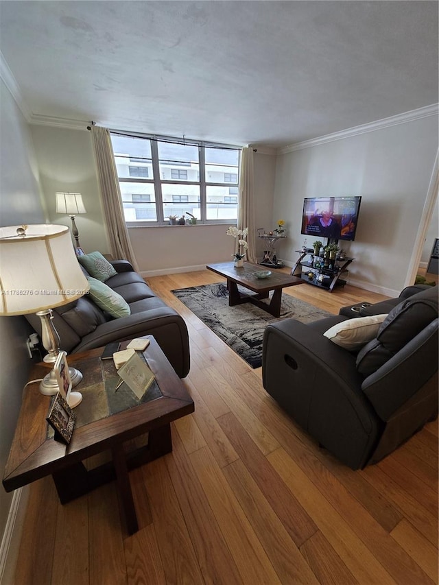 5825 Collins Ave Unit 2D, Miami Beach, FL 33140 - living area featuring baseboards, wood finished floors, and crown molding